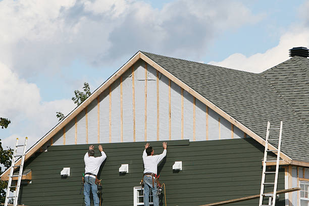 Professional Storm Damage Siding Repair technician working in Jeffersonville, OH